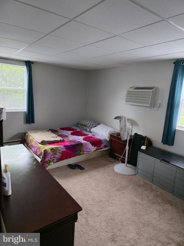 9618 Hoff St, Philadelphia, PA 19115 - carpeted bedroom with an AC wall unit, multiple windows, and a paneled ceiling