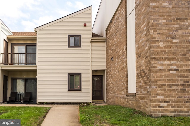 702 Downing Ct, Westampton, NJ 08060 - view of front of house with a balcony, brick siding, and a shingled roof