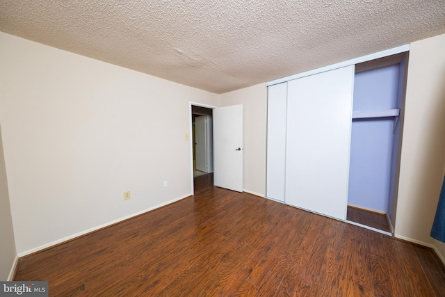 702 Downing Ct, Westampton, NJ 08060 - unfurnished bedroom featuring wood finished floors, a closet, baseboards, and a textured ceiling