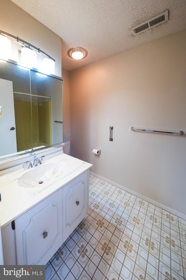 702 Downing Ct, Westampton, NJ 08060 - full bath featuring vanity, a textured ceiling, baseboards, and a shower