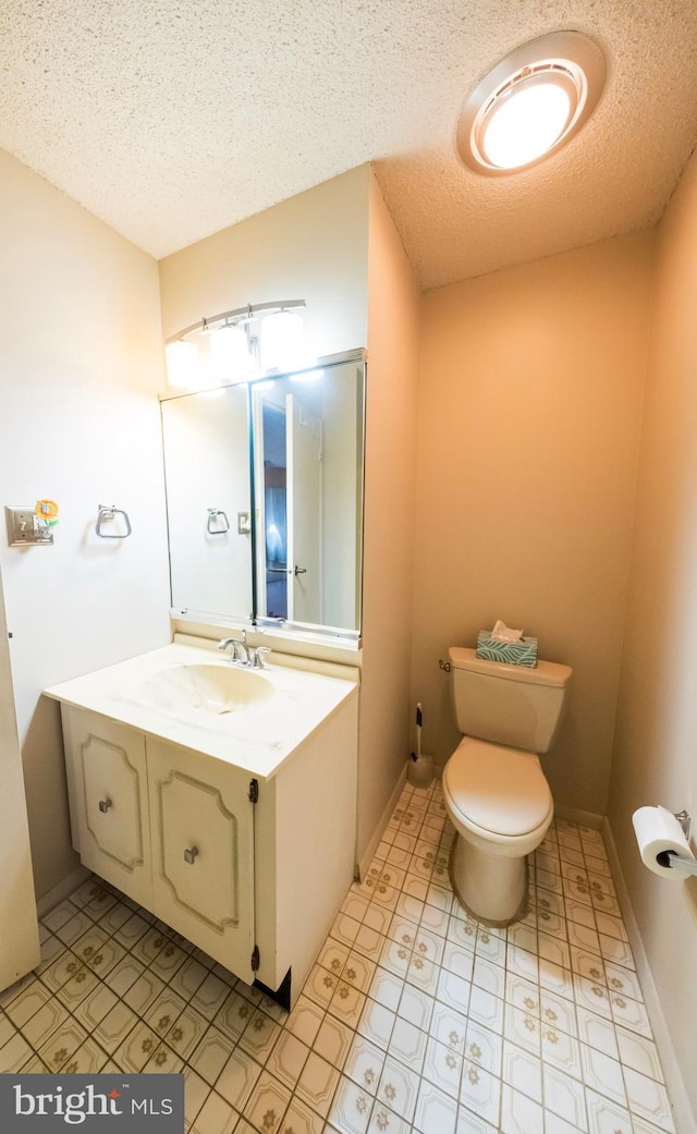 702 Downing Ct, Westampton, NJ 08060 - bathroom featuring a textured ceiling, toilet, and vanity
