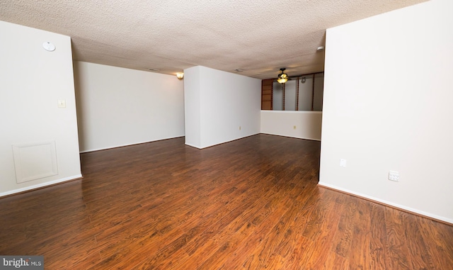 702 Downing Ct, Westampton, NJ 08060 - spare room featuring dark wood-style floors, a textured ceiling, and baseboards