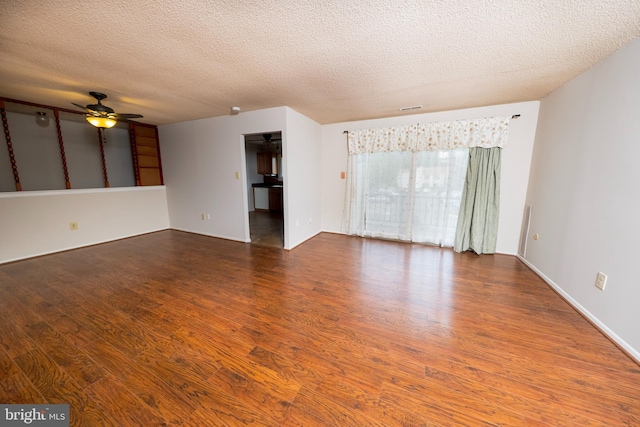 702 Downing Ct, Westampton, NJ 08060 - unfurnished living room featuring wood finished floors, ceiling fan, and a textured ceiling