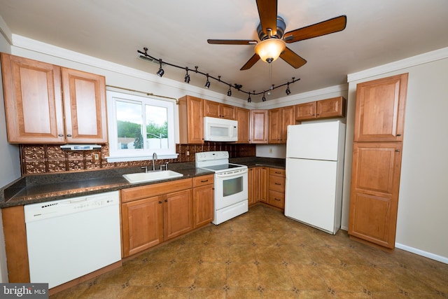 702 Downing Ct, Westampton, NJ 08060 - kitchen with white appliances, a sink, dark countertops, and track lighting