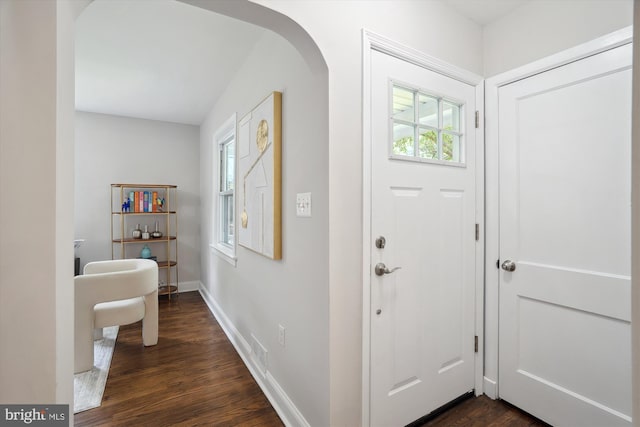5609 35th Ave, Hyattsville, MD 20782 - foyer entrance featuring arched walkways, dark wood-style flooring, and baseboards