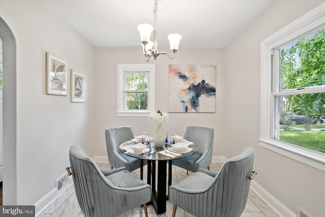 5609 35th Ave, Hyattsville, MD 20782 - dining area featuring healthy amount of natural light, a chandelier, and baseboards