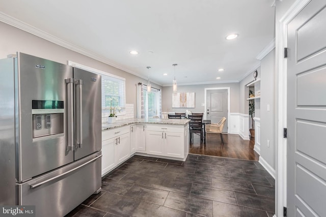 9532 Lyons Mill Rd, Owings Mills, MD 21117 - kitchen with high end refrigerator, a peninsula, white cabinetry, crown molding, and light stone counters