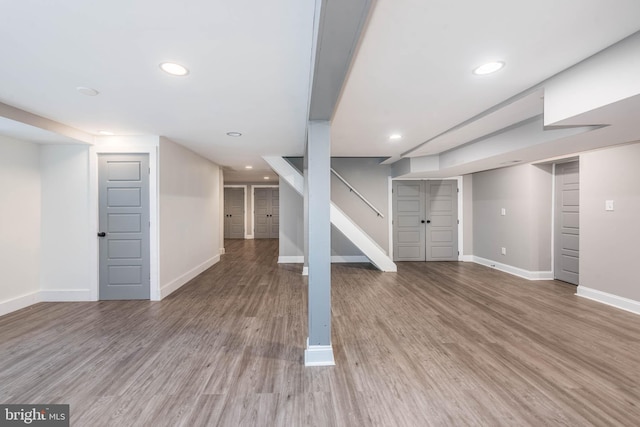 9532 Lyons Mill Rd, Owings Mills, MD 21117 - finished basement with baseboards, wood finished floors, recessed lighting, and stairway