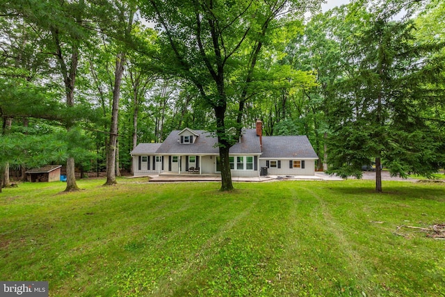 9532 Lyons Mill Rd, Owings Mills, MD 21117 - rear view of house with a lawn and a chimney