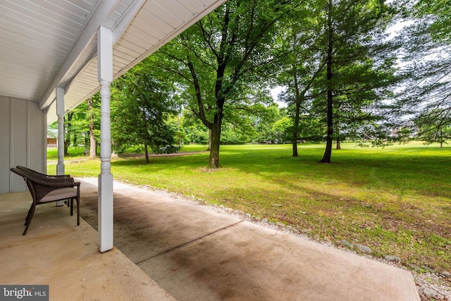 9532 Lyons Mill Rd, Owings Mills, MD 21117 - covered porch featuring a lawn
