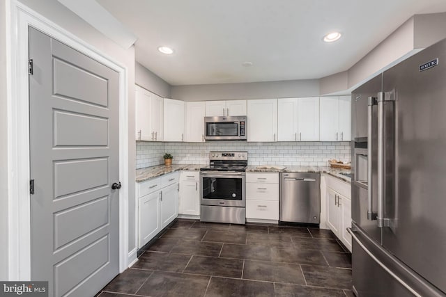 9532 Lyons Mill Rd, Owings Mills, MD 21117 - kitchen featuring stainless steel appliances, light stone countertops, white cabinets, backsplash, and recessed lighting