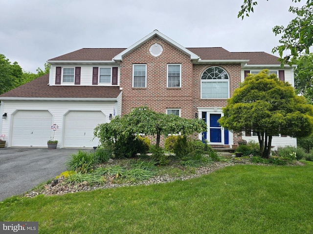 6 Reservoir Cir, Leesport, PA 19533 - view of front of home featuring driveway, a front yard, roof with shingles, and brick siding
