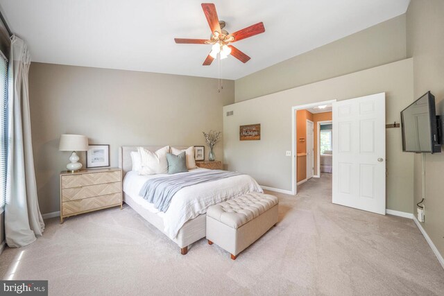 43501 Plantation Ter, Ashburn, VA 20147 - bedroom with light carpet, baseboards, vaulted ceiling, and a ceiling fan