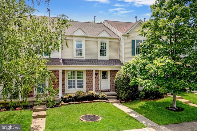 43501 Plantation Ter, Ashburn, VA 20147 - view of property featuring a shingled roof, brick siding, and a front lawn