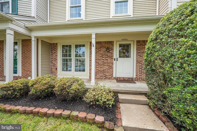 43501 Plantation Ter, Ashburn, VA 20147 - property entrance featuring brick siding and covered porch