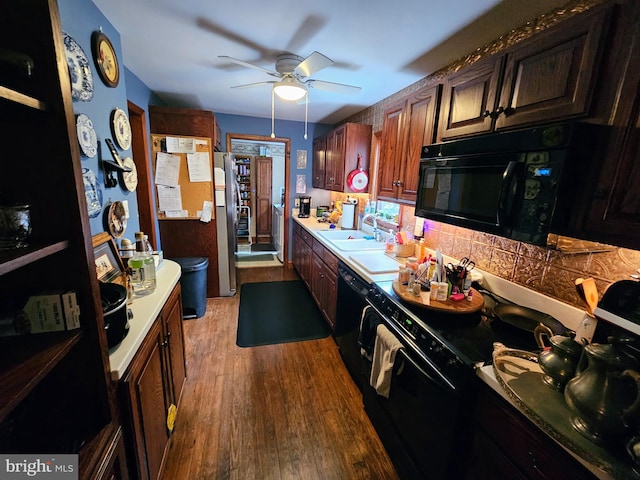 35 Read St, Seaford, DE 19973 - kitchen with black appliances, ceiling fan, a sink, wood finished floors, and light countertops