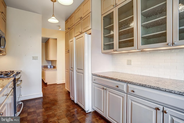 4000 Cathedral Ave NW Unit 517B, Washington, DC 20016 - kitchen featuring stainless steel appliances, backsplash, glass insert cabinets, light stone counters, and hanging light fixtures