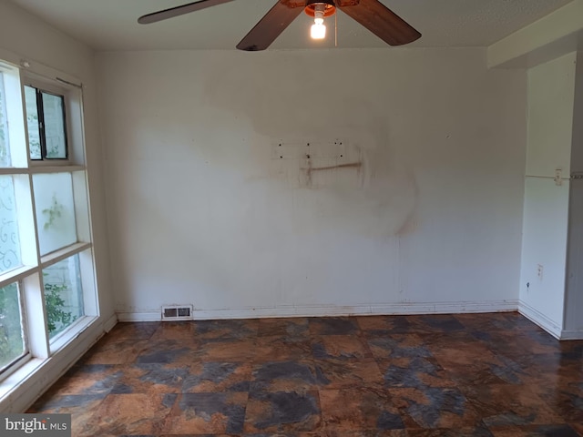 1911 Ray Leonard Rd, Landover, MD 20785 - empty room featuring healthy amount of natural light, ceiling fan, and baseboards