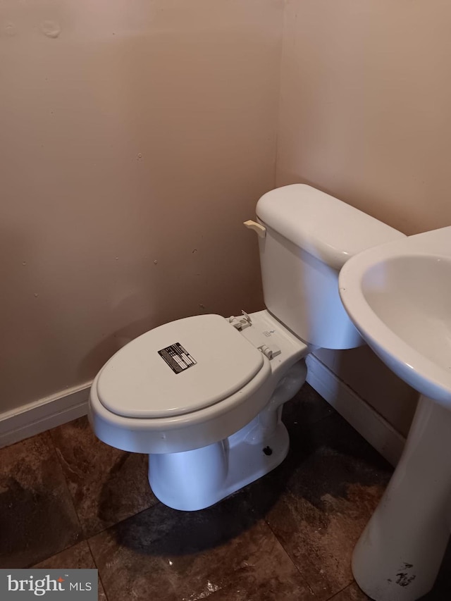 1911 Ray Leonard Rd, Landover, MD 20785 - half bathroom featuring toilet and baseboards