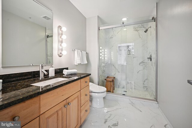 811 4th St NW Unit 720, Washington, DC 20001 - full bath with marble look tiles, toilet, vanity, and a marble finish shower