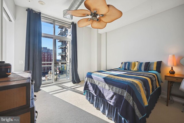 811 4th St NW Unit 720, Washington, DC 20001 - carpeted bedroom featuring a city view, access to exterior, and a ceiling fan