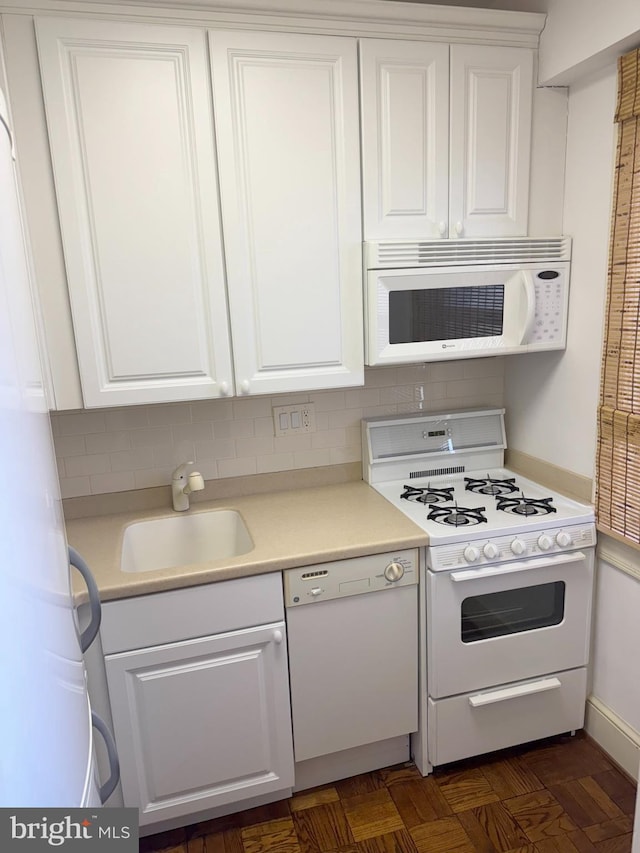 4000 Cathedral Ave NW Unit 518B, Washington, DC 20016 - kitchen with white appliances, white cabinetry, and decorative backsplash