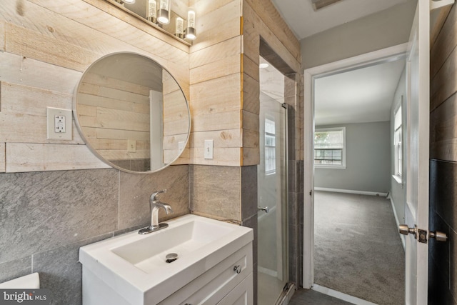 254 Bryn Mawr Ave, Lansdowne, PA 19050 - bathroom with vanity, a shower stall, baseboards, and tile walls