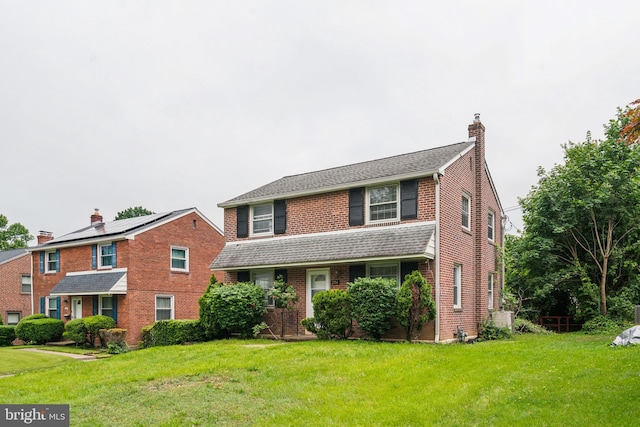 254 Bryn Mawr Ave, Lansdowne, PA 19050 - view of front of home featuring a front yard, a chimney, and brick siding