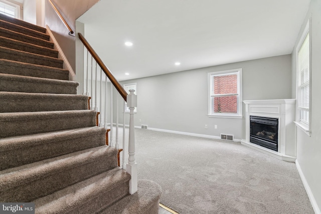 254 Bryn Mawr Ave, Lansdowne, PA 19050 - staircase with carpet flooring, a glass covered fireplace, baseboards, and recessed lighting