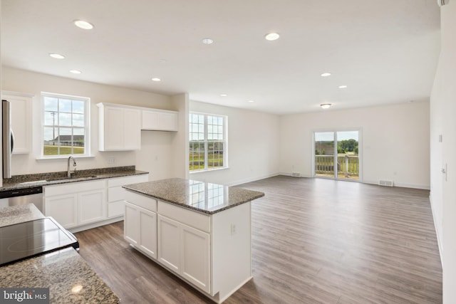 2673 Victorian Dr Lot 64, Dover, PA 17315 - kitchen featuring wood finished floors, dark stone counters, a sink, a center island, and recessed lighting