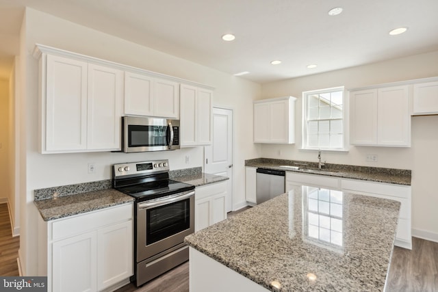 2673 Victorian Dr Lot 64, Dover, PA 17315 - kitchen featuring appliances with stainless steel finishes, a sink, wood finished floors, white cabinets, and recessed lighting