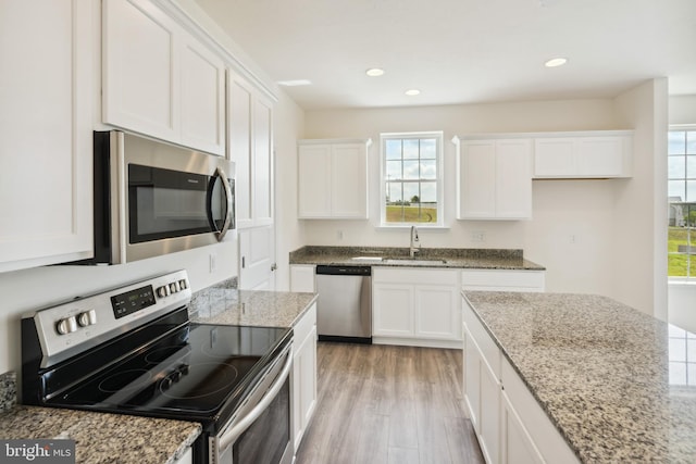2673 Victorian Dr Lot 64, Dover, PA 17315 - kitchen with stainless steel appliances, white cabinetry, healthy amount of natural light, light wood-style floors, and recessed lighting