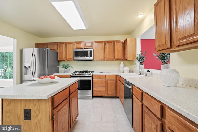 13412 Glen Taylor Ln, Herndon, VA 20171 - kitchen featuring stainless steel appliances, a kitchen island, brown cabinets, and recessed lighting