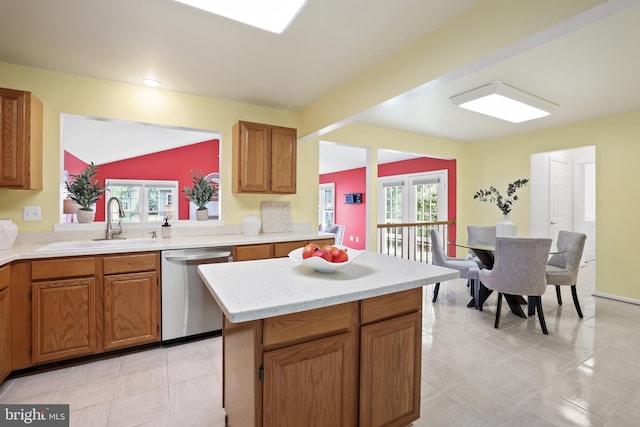 13412 Glen Taylor Ln, Herndon, VA 20171 - kitchen featuring stainless steel dishwasher, light countertops, healthy amount of natural light, a center island, and vaulted ceiling