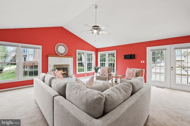 13412 Glen Taylor Ln, Herndon, VA 20171 - carpeted living area with lofted ceiling, plenty of natural light, a fireplace, a ceiling fan, and french doors