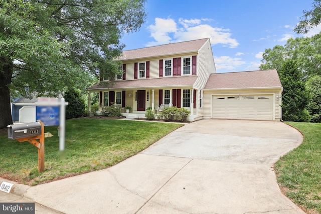 13412 Glen Taylor Ln, Herndon, VA 20171 - colonial house with covered porch, concrete driveway, an attached garage, and a front lawn