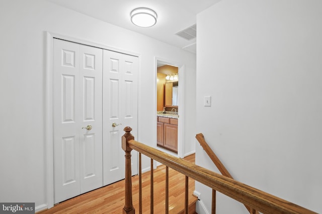 13412 Glen Taylor Ln, Herndon, VA 20171 - hall featuring an upstairs landing and light wood finished floors