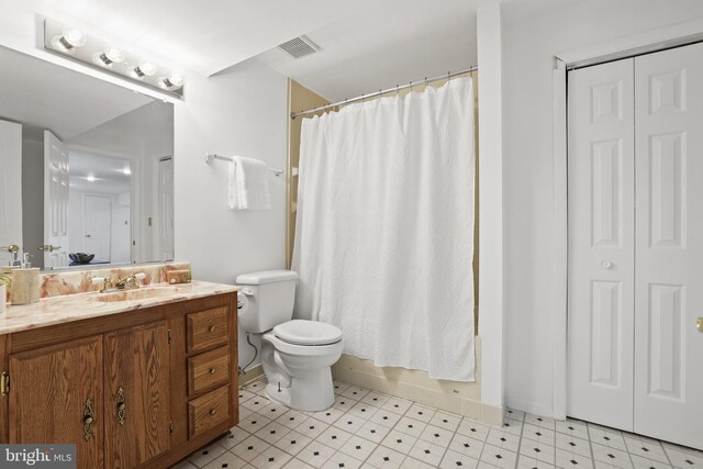 13412 Glen Taylor Ln, Herndon, VA 20171 - bathroom with vanity, tile patterned floors, and a closet