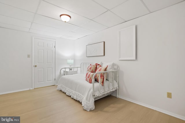 13412 Glen Taylor Ln, Herndon, VA 20171 - bedroom featuring light wood-type flooring and a paneled ceiling
