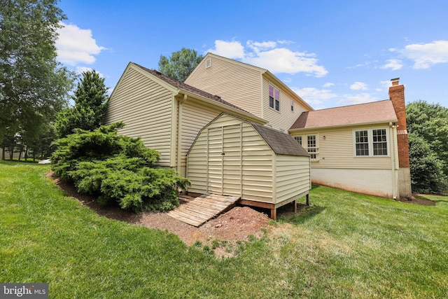 13412 Glen Taylor Ln, Herndon, VA 20171 - rear view of house with a yard, a chimney, and a shingled roof