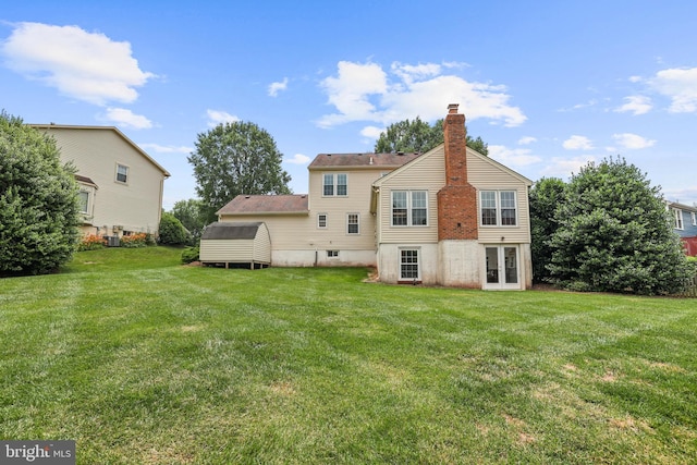 13412 Glen Taylor Ln, Herndon, VA 20171 - rear view of property with a lawn and a chimney