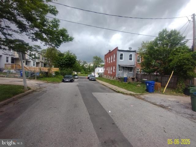 608 Chestnut Hill Ave, Baltimore, MD 21218 - view of asphalt road with curbs, sidewalks, and a residential view