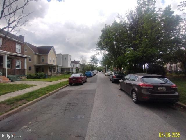 608 Chestnut Hill Ave, Baltimore, MD 21218 - view of asphalt street with a residential view, sidewalks, and curbs