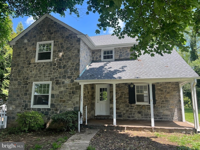 109 W Philadelphia Ave, Boyertown, PA 19512 - view of front facade featuring stone siding, a porch, and roof with shingles