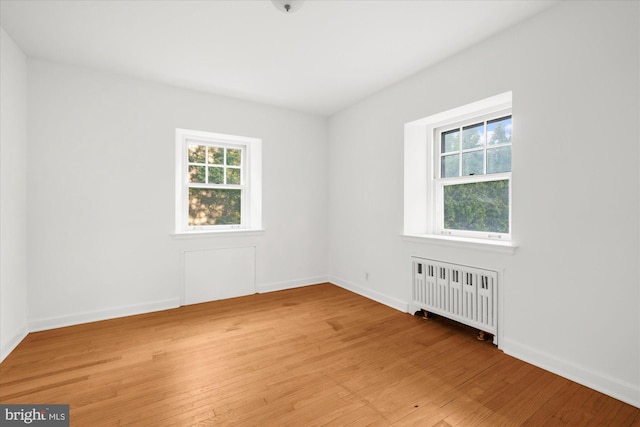 109 W Philadelphia Ave, Boyertown, PA 19512 - spare room with radiator heating unit, plenty of natural light, and light wood-style floors