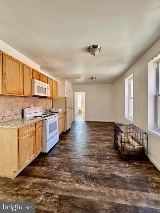 240 W Glenwood Ave, Philadelphia, PA 19140 - kitchen with white appliances, dark wood-style floors, plenty of natural light, and decorative backsplash