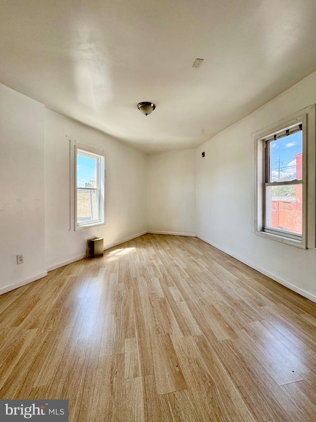 240 W Glenwood Ave, Philadelphia, PA 19140 - spare room featuring light wood-style flooring, plenty of natural light, and baseboards