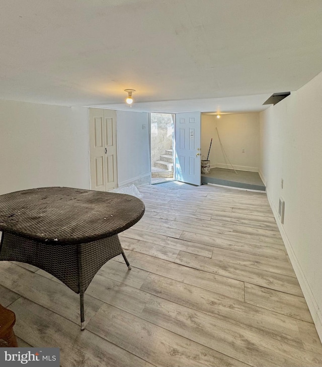 240 W Glenwood Ave, Philadelphia, PA 19140 - dining space featuring light wood-style flooring, baseboards, and stairs