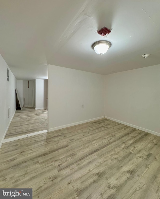 240 W Glenwood Ave, Philadelphia, PA 19140 - spare room with light wood-style floors, a smoke detector, and baseboards