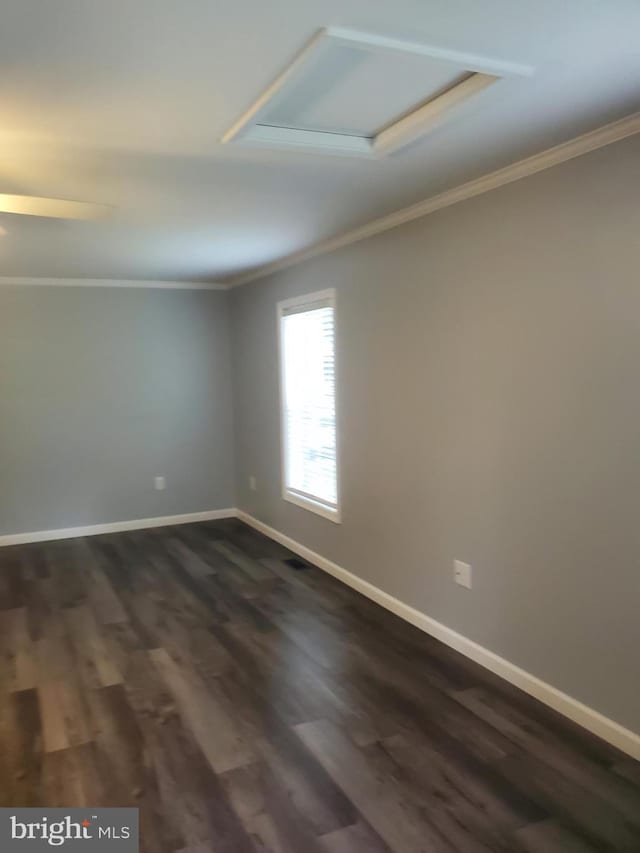 113 Beech Tree Ln, Harrington, DE 19952 - unfurnished room featuring ornamental molding, dark wood finished floors, baseboards, and attic access